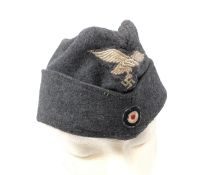 WW2 German Luftwaffe side cap, blue wool with embroidered other ranks pattern eagle and cockade,