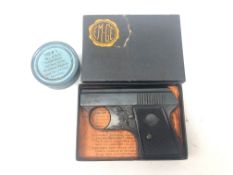 EM-GE top vent black finish starting pistol, with instructions in original box with a tin of 100 No.