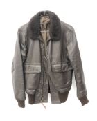 US Air Force style brown leather flying type jacket, buttoned sheepskin collar and twin pockets,