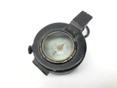 WWII Military compass in black japanned brass case, stamped on base EAC, No.