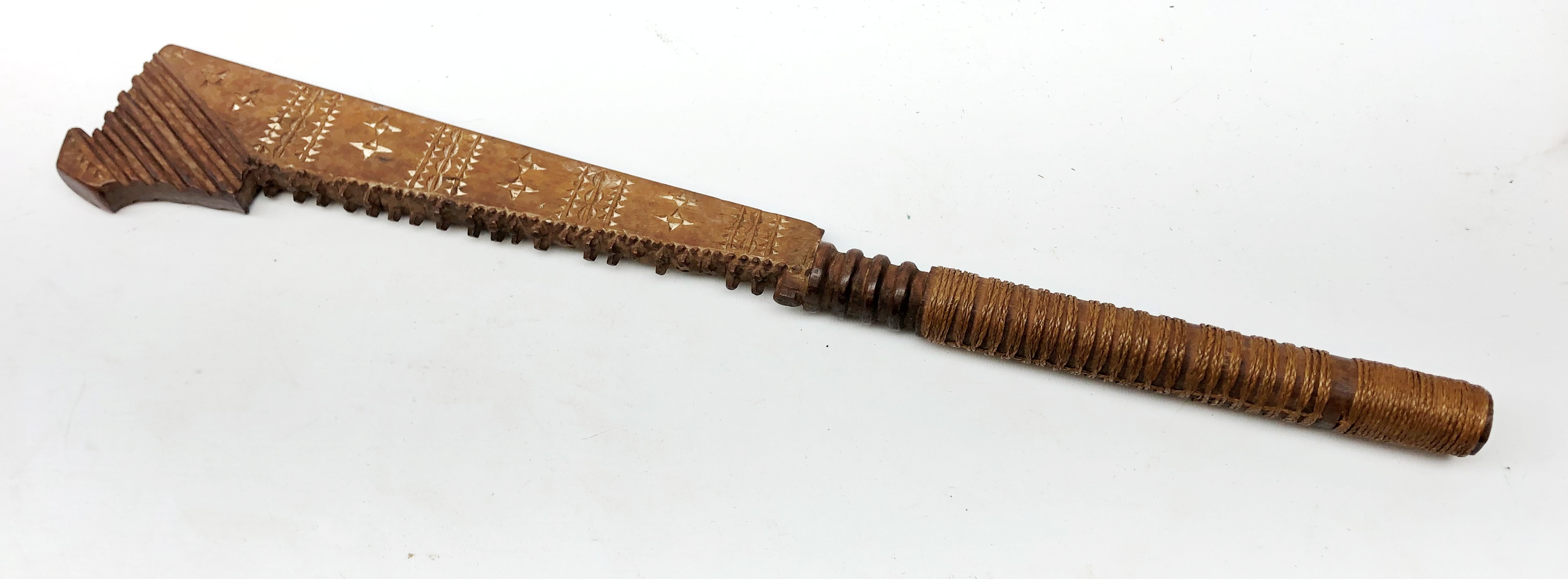 Samoan wooden club, shaped blade with serrated edge and painted geometric decoration,