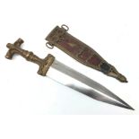 Late 19th century Eastern brass dagger, 23cm twin edge tapering steel blade,