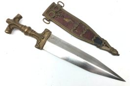 Late 19th century Eastern brass dagger, 23cm twin edge tapering steel blade,