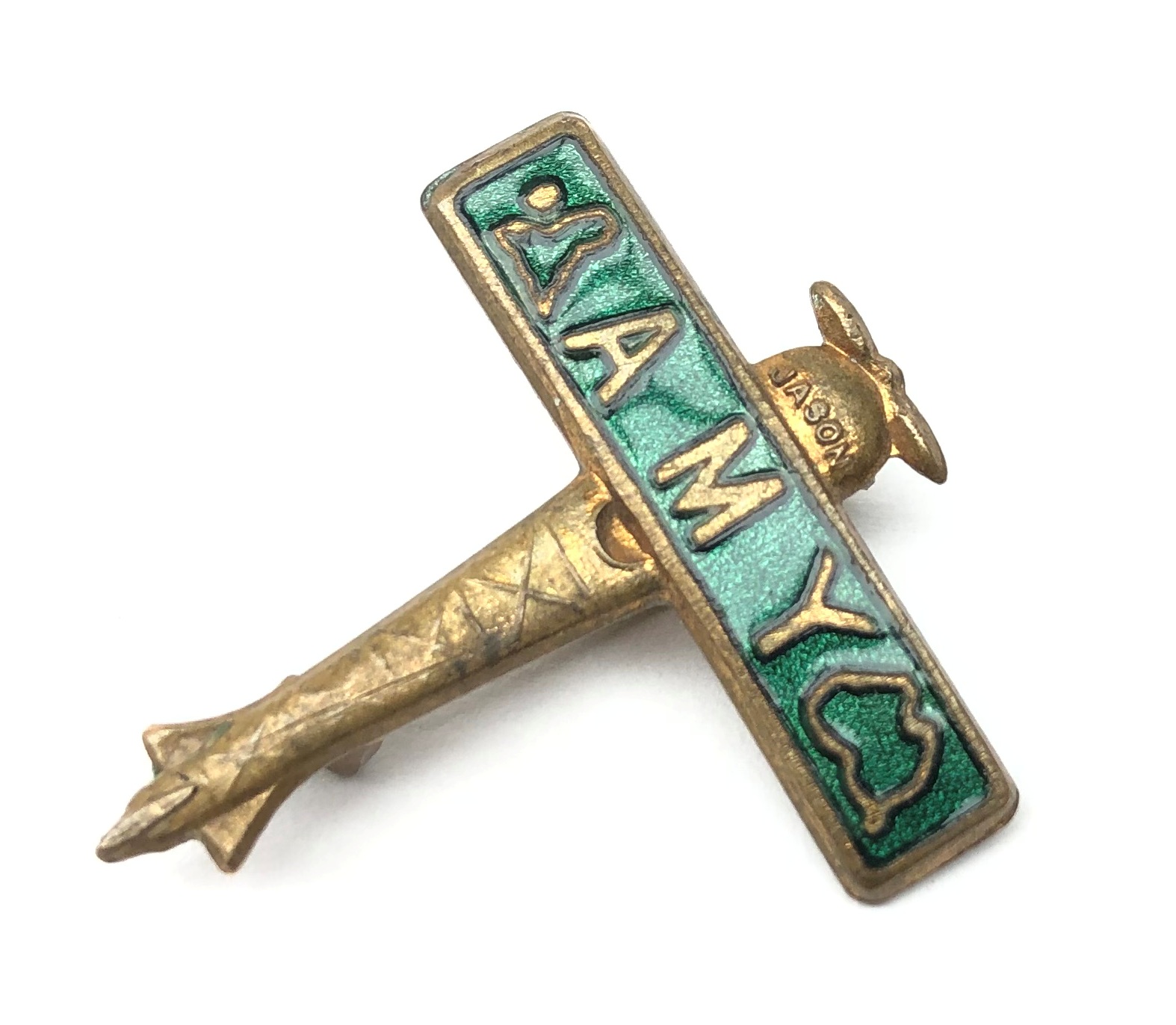 Amy Johnson Souvenir pin badge in the form of a green enamelled aeroplane,