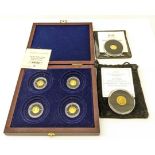 Cased set of four miniature 14ct gold medallions 'Year of Three Kings',