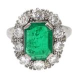 Platinum emerald cut emerald and diamond cluster ring,