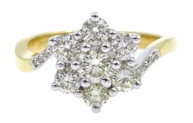 18ct gold seven stone flower cluster ring, with diamond set shoulders hallmarked,