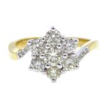 18ct gold seven stone flower cluster ring, with diamond set shoulders hallmarked,