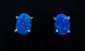 Pair of silver oval opal stud earrings,