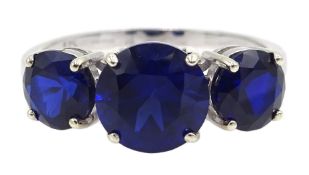 9ct white gold three stone synthetic blue sapphire ring,