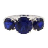 9ct white gold three stone synthetic blue sapphire ring,