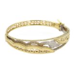 Asian 18ct white and yellow gold open work hinged bangle, stamped 750, approx 11.