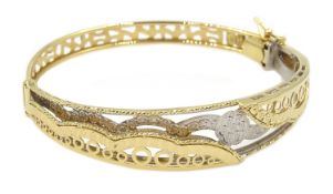 Asian 18ct white and yellow gold open work hinged bangle, stamped 750, approx 11.