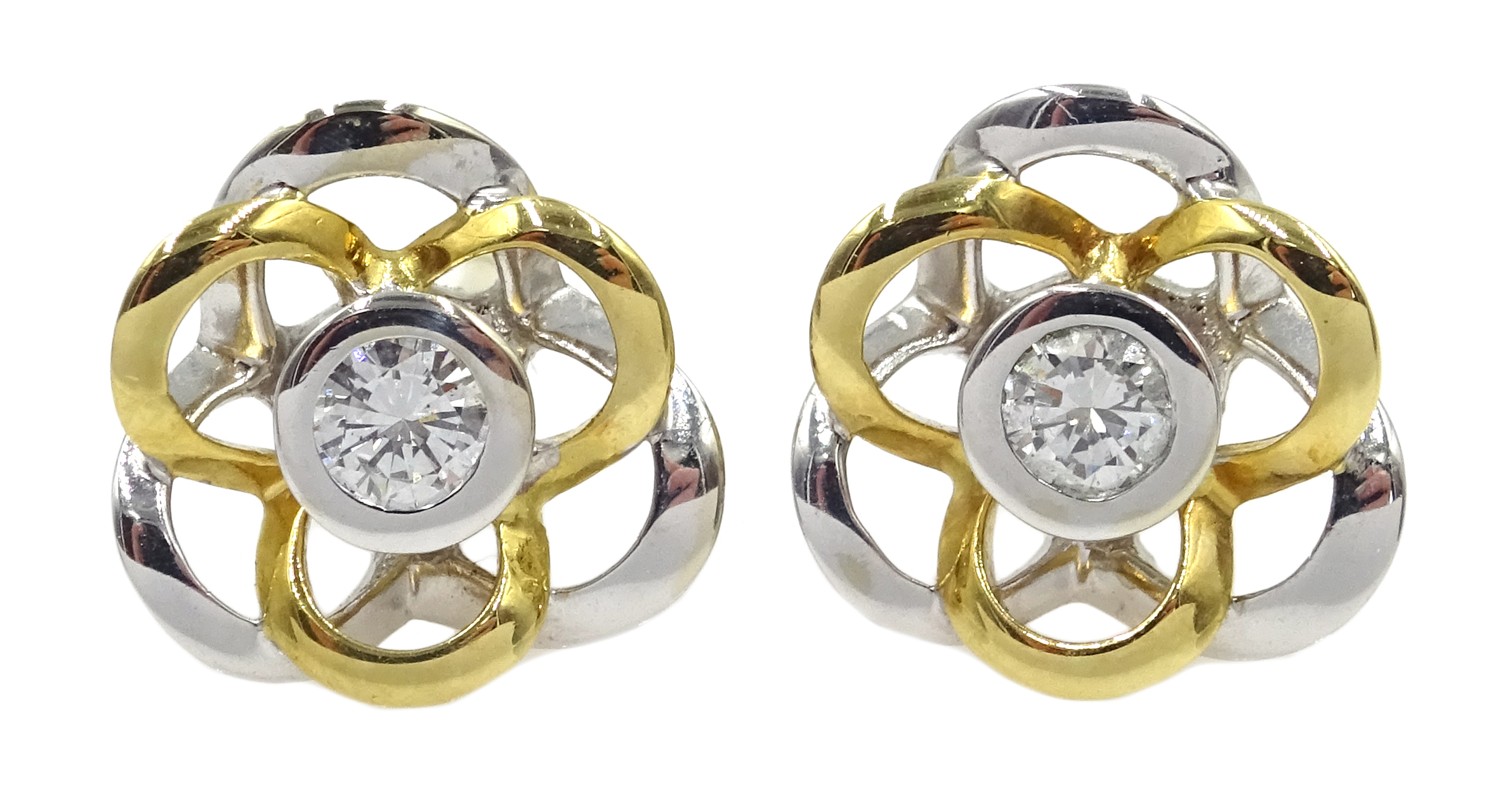 Pair of 18ct white and yellow gold diamond set flower stud earrings,
