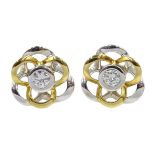 Pair of 18ct white and yellow gold diamond set flower stud earrings,