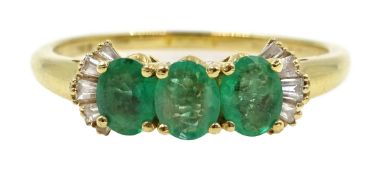 Iliana gold oval emerald and baguette diamond ring,