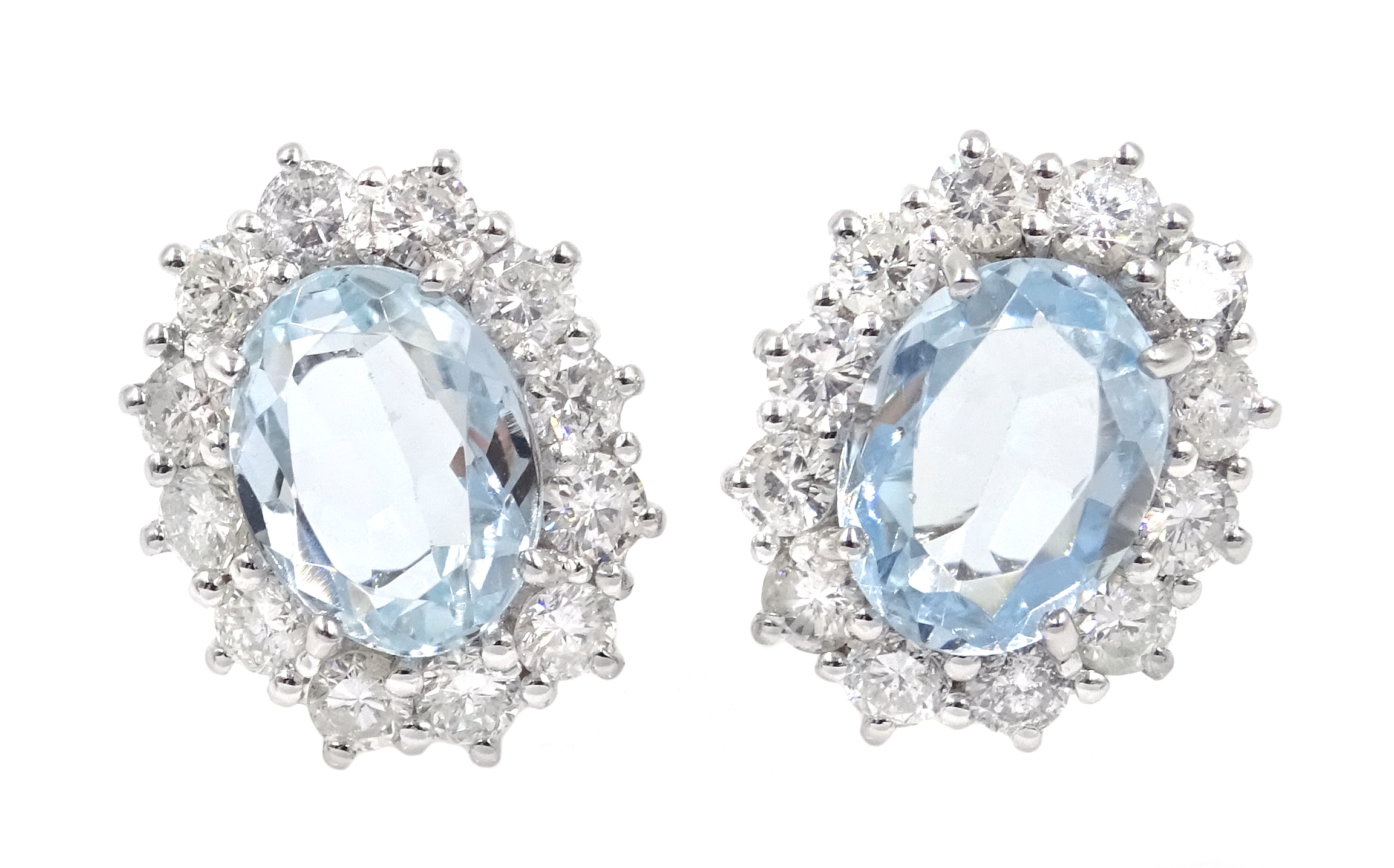 Pair of 18ct white gold aquamarine and diamond cluster earrings hallmarked,