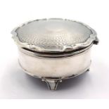 Silver lidded jewellery box raised on four legs, engine turned decoration Birmingham 1926, H4.