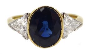 18ct gold oval sapphire and two trillion cut diamond ring, hallmarked, sapphire 2.