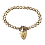 9ct gold cub link bracelet with heart locket, each link stamped 9.375, approx 15.