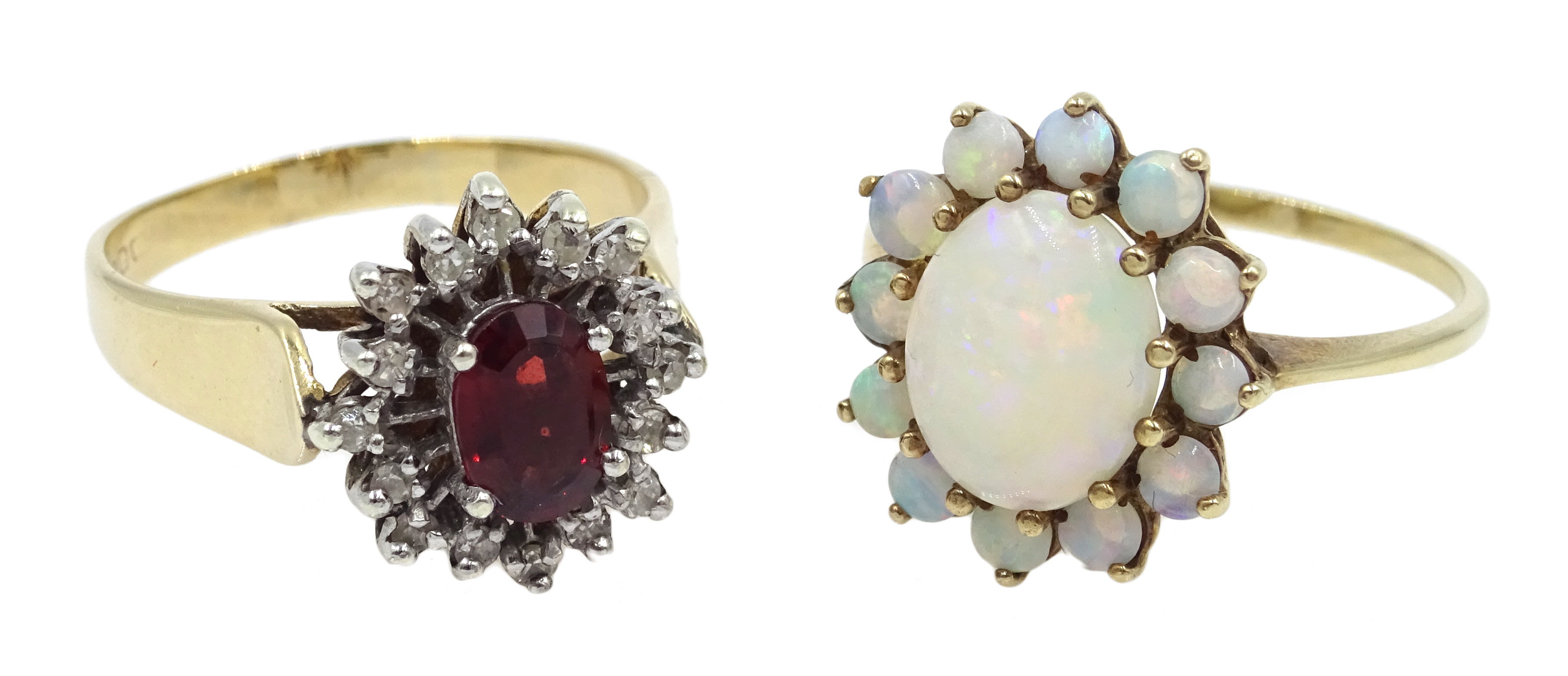 Gold opal cluster ring and a garnet and diamond cluster ring,
