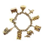 Gold curb chain bracelet, with eight gold charms including temple, car, church, train,