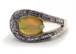 Silver oval opal and diamond contemporary design ring,