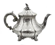 Victorian silver teapot embossed and engraved decoration, scroll feet with eagle finial by Edward,