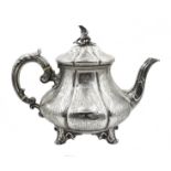 Victorian silver teapot embossed and engraved decoration, scroll feet with eagle finial by Edward,