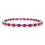 18ct white gold oval ruby and round brilliant cut diamond bracelet, stamped 750,