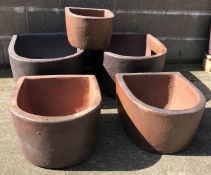 Two large 'D' shaped rustic frost proof pots (W51cm, H33cm, D61cm),