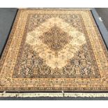 Keshan blue and gold ground rug, central medallion repeating border,