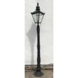 Victorian style cast iron street lamp post with glass lantern top,