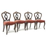 Victorian set of four rosewood salon chairs each with pierced back,