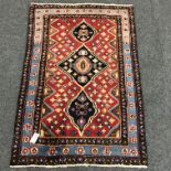 Persian style red and blue ground rug, repeating border,