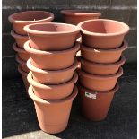 Twenty circular tapering terracotta flower pots, D34cm,