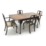 Regency style walnut extending dining table, acanthus carved cabriole legs on pad feet,