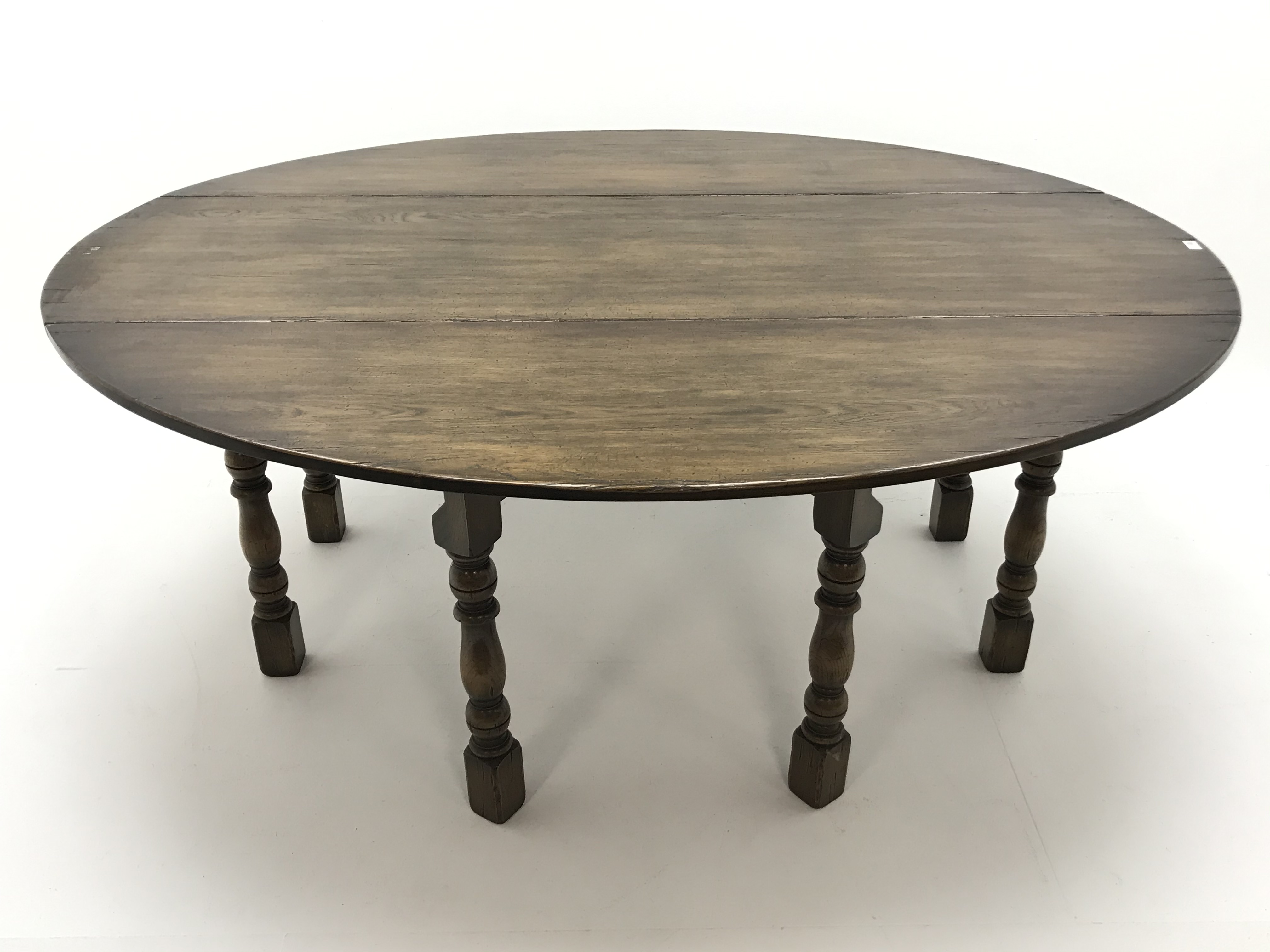 Medium oak oval drop leaf wake dining table on turned gate leg base (L198cm x W156cm, - Image 3 of 5