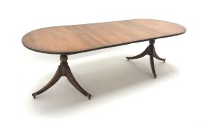 Quality Regency style inlaid mahogany twin pedestal dining table with two leaves,