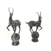 Pair cast metal garden stags on spherical mounts, figures/gate post finials,