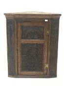 19th century heavily carved oak wall hanging corner cupboard, single door, W86cm, H106cm,