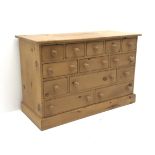 Solid pine thirteen multi-drawer chest, plinth base, W157cm, H77cm,