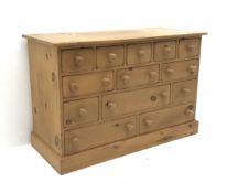 Solid pine thirteen multi-drawer chest, plinth base, W157cm, H77cm,