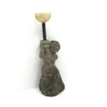 Composite stone figure of boy carrying on pot on his shoulder,