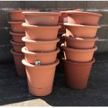 Twenty circular tapering terracotta flower pots, D34cm,