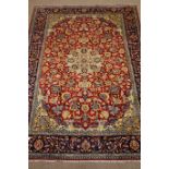 Najaf Abad red ground rug, central medallion, repeating border,