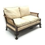 Early 20th century walnut two seat Bergere sofa, scrolled arms,