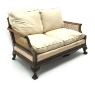 Early 20th century walnut two seat Bergere sofa, scrolled arms,