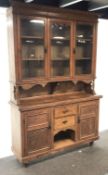 19th century pine bookcase on cupboard, projecting cornice,