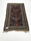 Balouch style blue ground rug, repeating border,